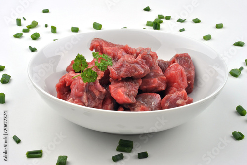 fresh beef lean diced steak in a bowl