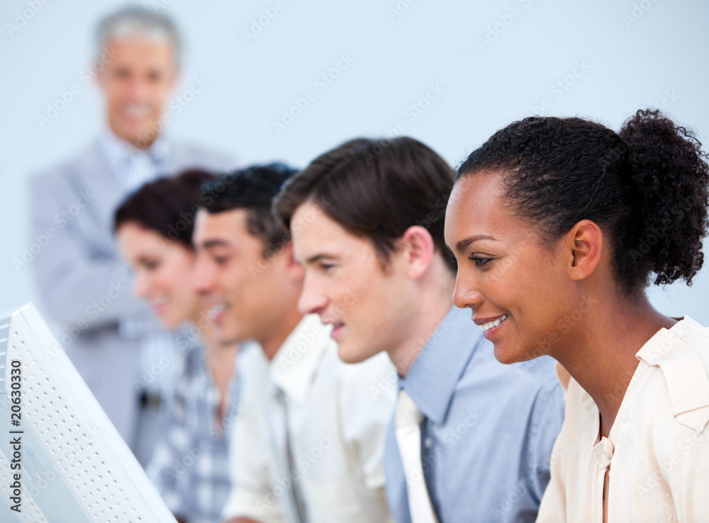 Multi-ethnic business people at work with their manager Multi-ethnic business people at work with their manager