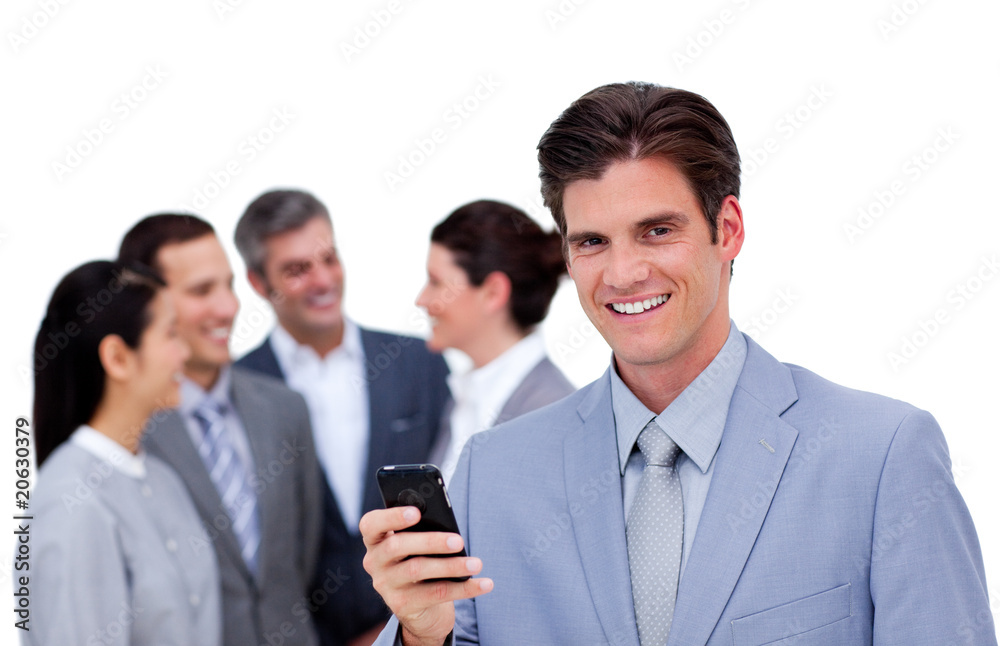 Charming manager on phone standig in front of his team Charming manager on phone standig in front of his team