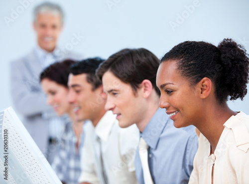 Multi-ethnic business people at work with their manager