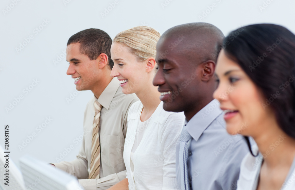 Multi-cultural business team working in the office Multi-cultural business team working in the office