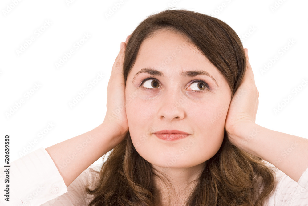Woman plugging her ears over white background Woman plugging her ears over white background