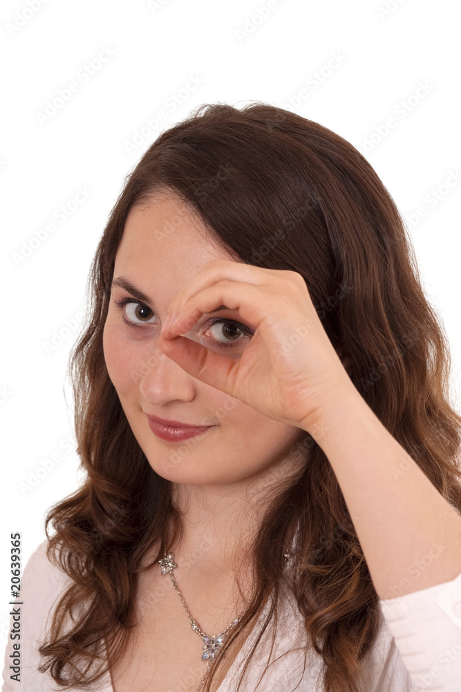 Young woman looking through hand