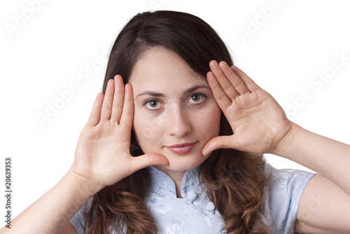 Young woman with still gesture (finger on lips) isolated