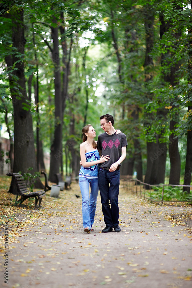 Fototapeta premium Man and woman on a walk in park