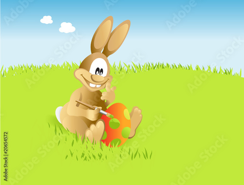osterhase malt auf Wiese