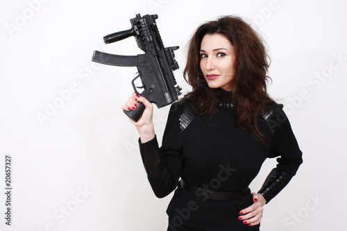 Beautiful woman with assault gun