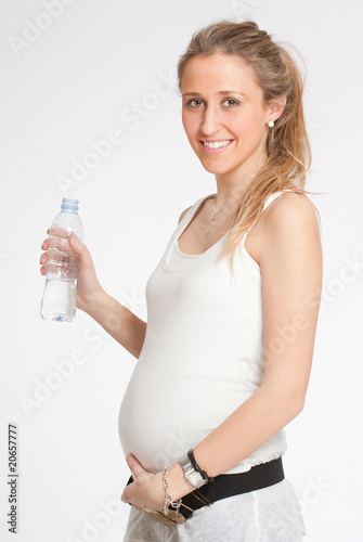 Expectant mother with a water bottle