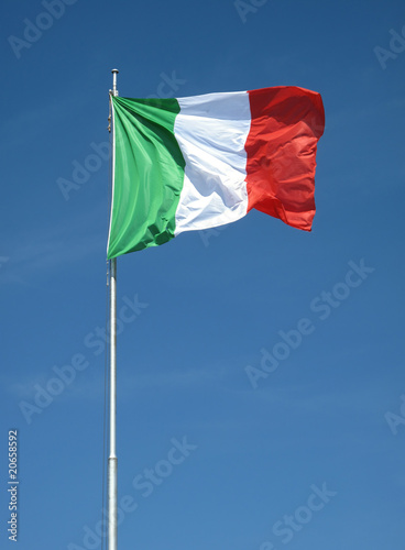 Waving Italian flag on natural sky