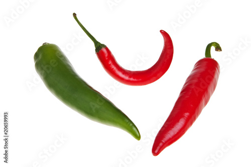Red and green spicy peppers isolated over white background.