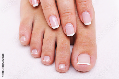 Beauty nails of a female hand and feet