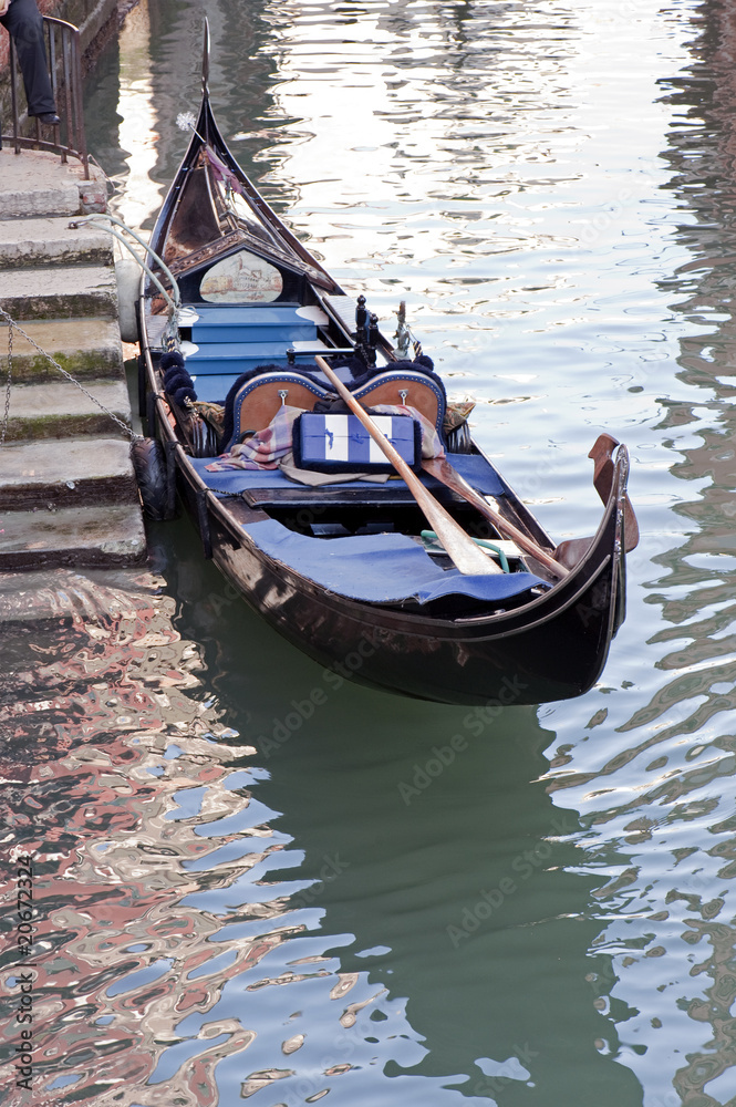 Gondola moored in a canal, Venice, Italy