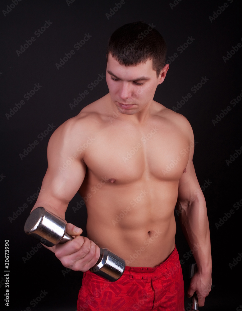 Fototapeta premium Well-trained man in gym