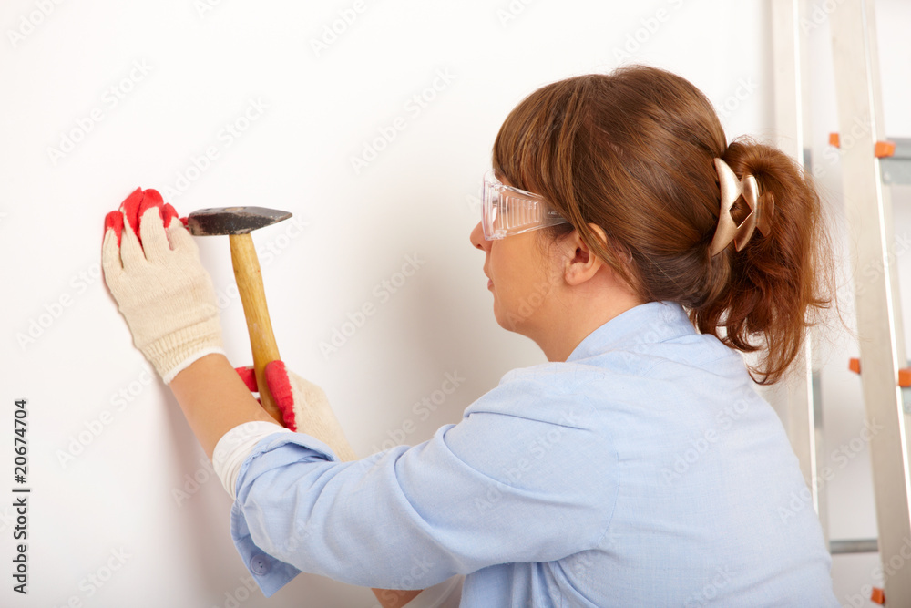 Woman working with hammer Woman working with hammer