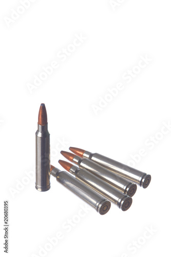 Five rifle cartridges isolated on white background