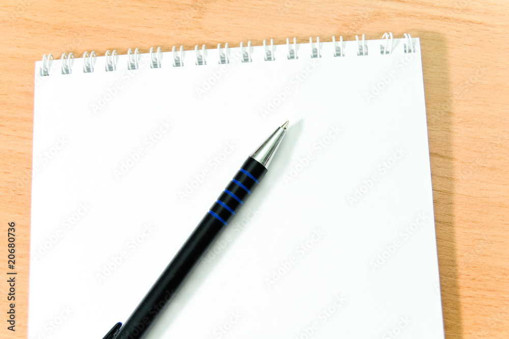 Pen on notebook. Pen on notebook.