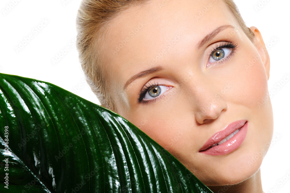 Sensitive beautyful woman face with a plant Sensitive beautyful woman face with a plant