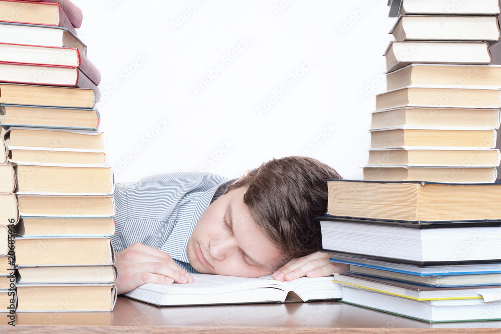 The sleeping student with books