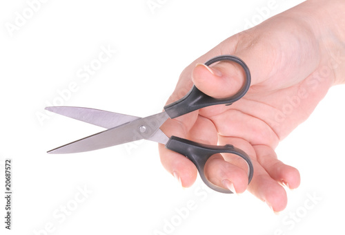 Scissors in woman hand