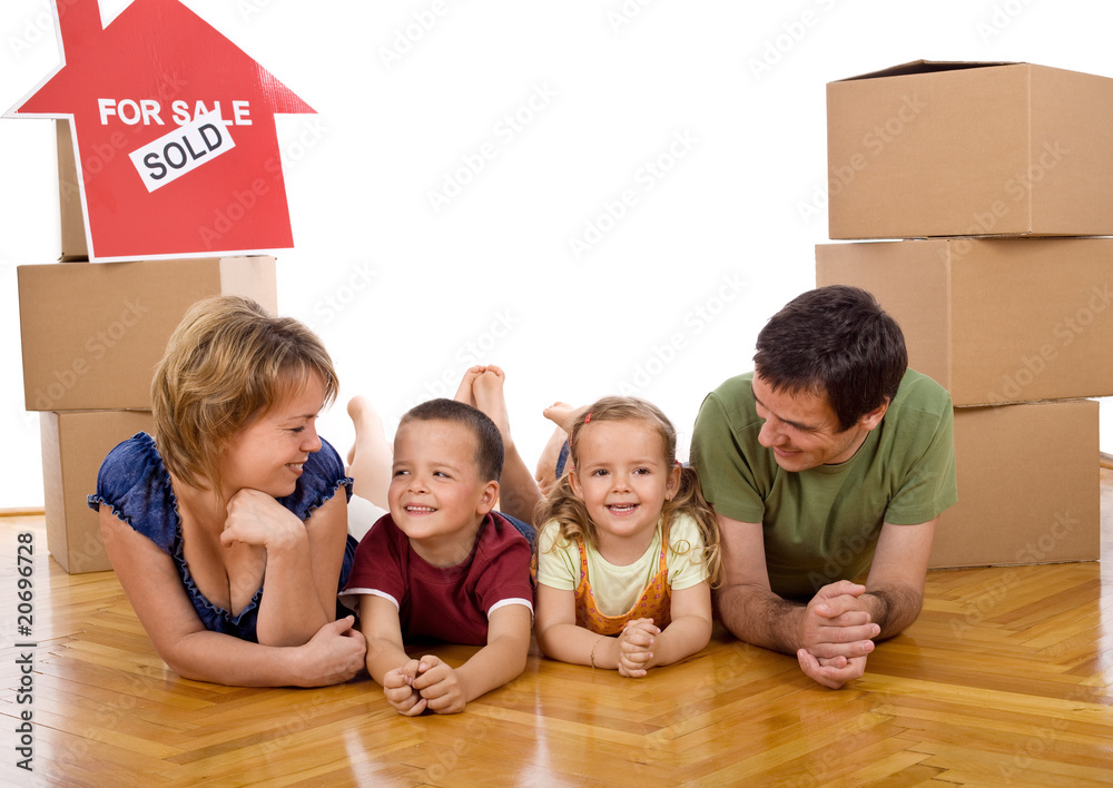 Fototapeta premium Happy family with two kids in their new home