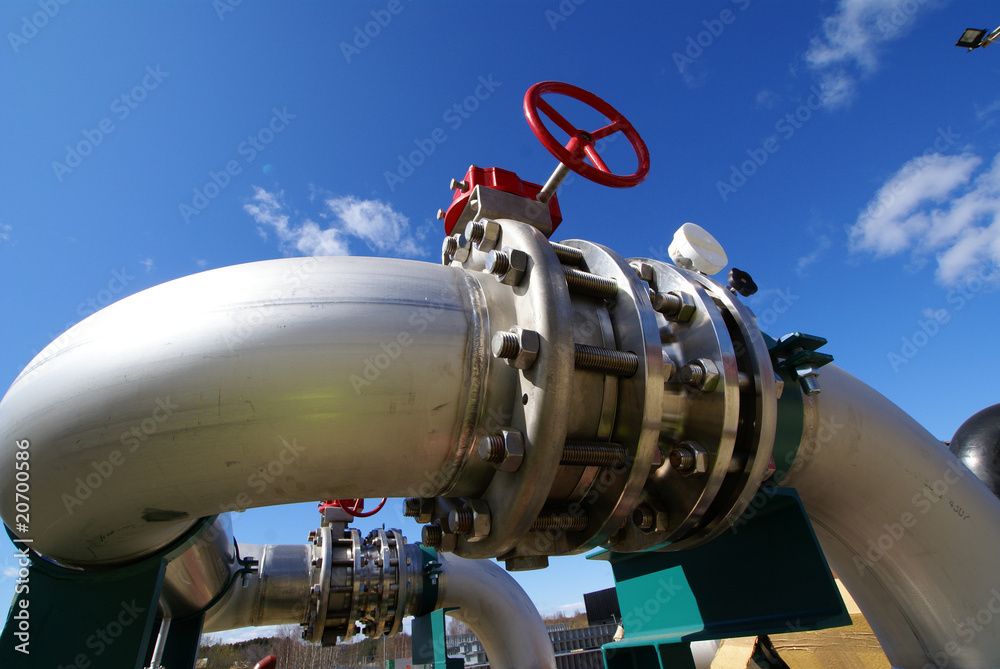Pipes, tubes, machinery and steam turbine at a power plant Pipes, tubes, machinery and steam turbine at a power plant