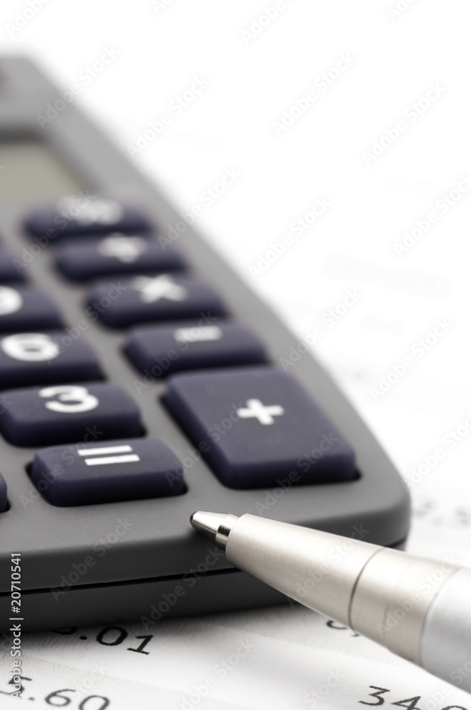 Calculator and pen close-up