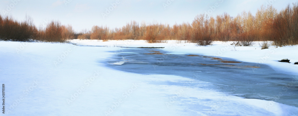 Frozen river. Melt in spring - threat of the flood. Natural disaster Frozen river. Melt in spring - threat of the flood. Natural disaster