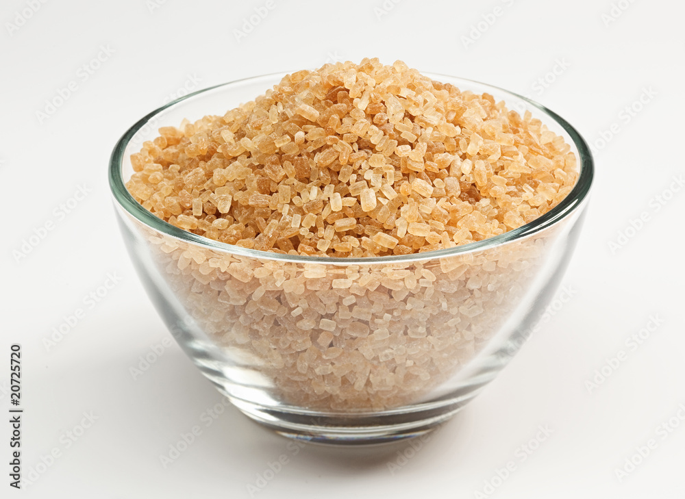 Cane sugar in a glass bowl Cane sugar in a glass bowl