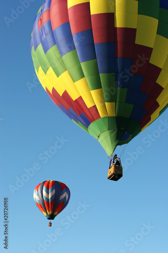 Hot air balloons are flying during a festival