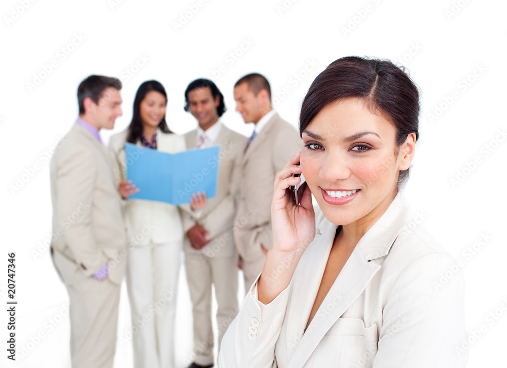 Portrait of a brunette businesswoman on phone with her team Portrait of a brunette businesswoman on phone with her team