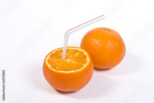 Half of orange with straw