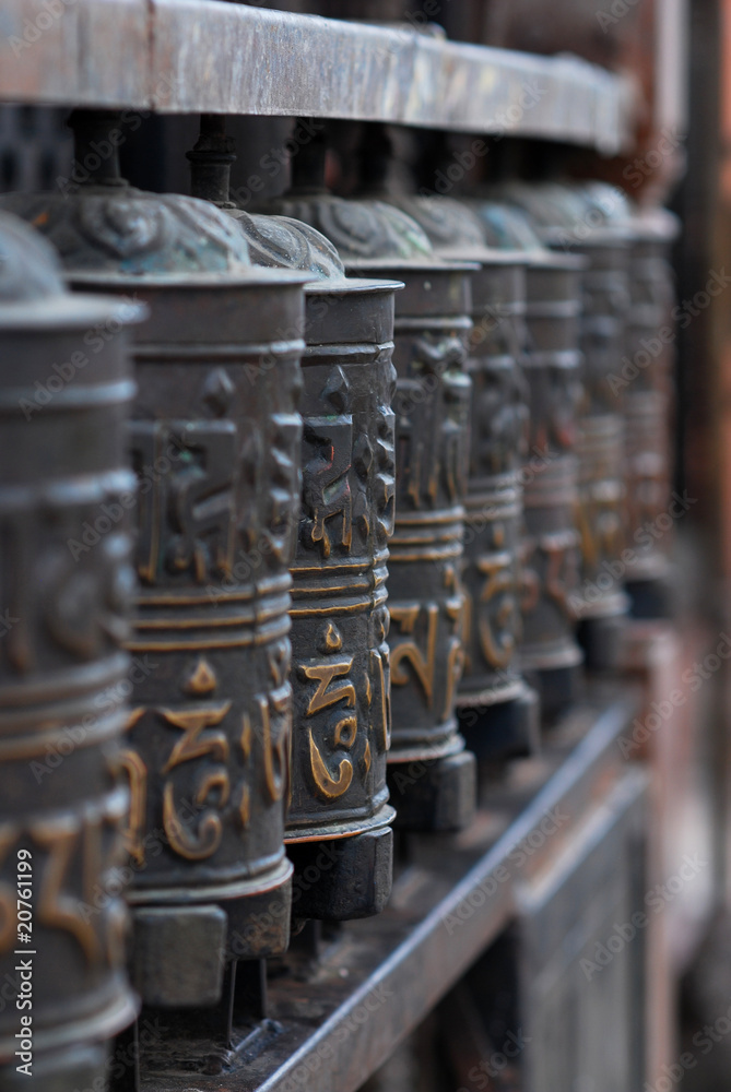 buddhist prayer wheels in a row buddhist prayer wheels in a row