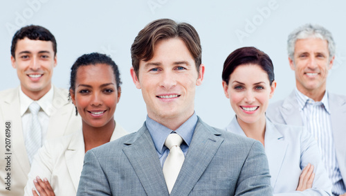 Fotografija Multi-ethnic business partners standing with folded arms