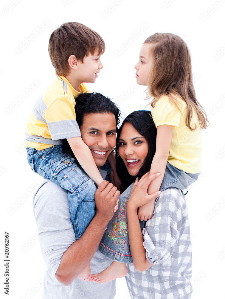 Smiling parents giving piggyback ride to their children Smiling parents giving piggyback ride to their children
