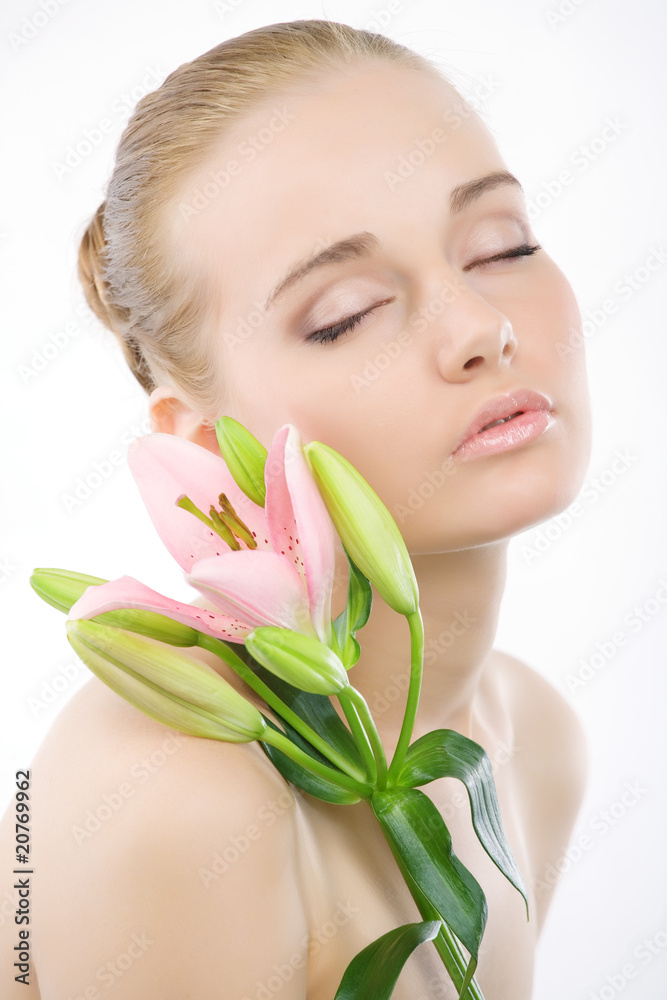 Woman face with a pink flower. Woman face with a pink flower.
