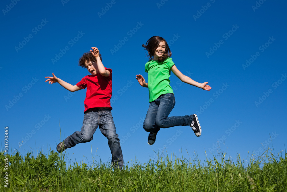 Girl and boy jumping, running outdoor Girl and boy jumping, running outdoor