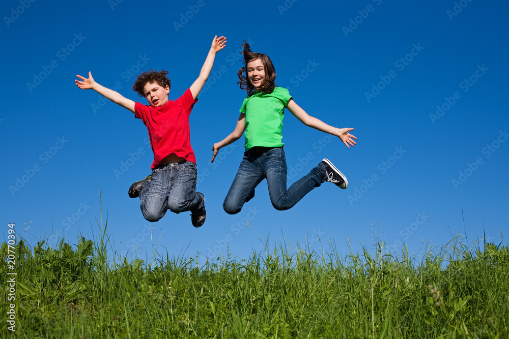 Girl and boy jumping, running outdoor Girl and boy jumping, running outdoor