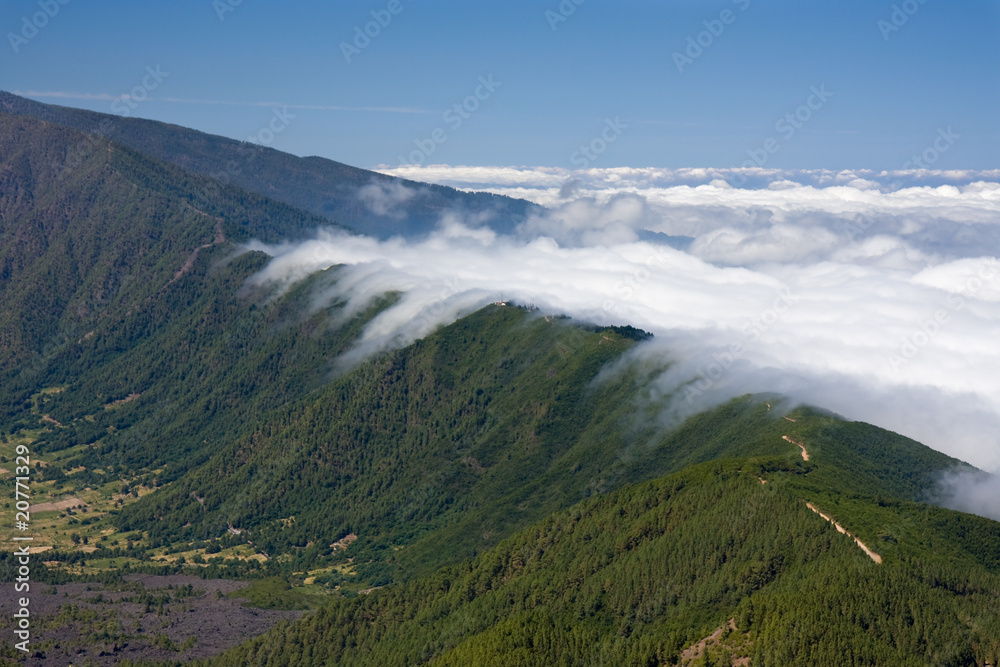 Clouds tumbling over a mountain ridge Canary Islands