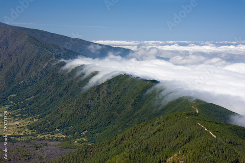 Clouds tumbling over a mountain ridge Canary Islands