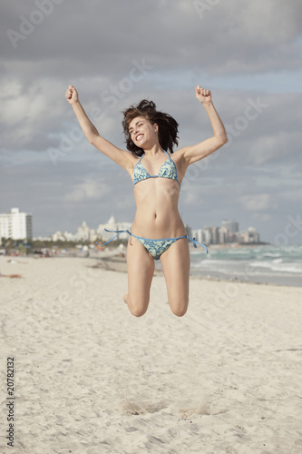 Woman jumping in mid-air © Felix Mizioznikov