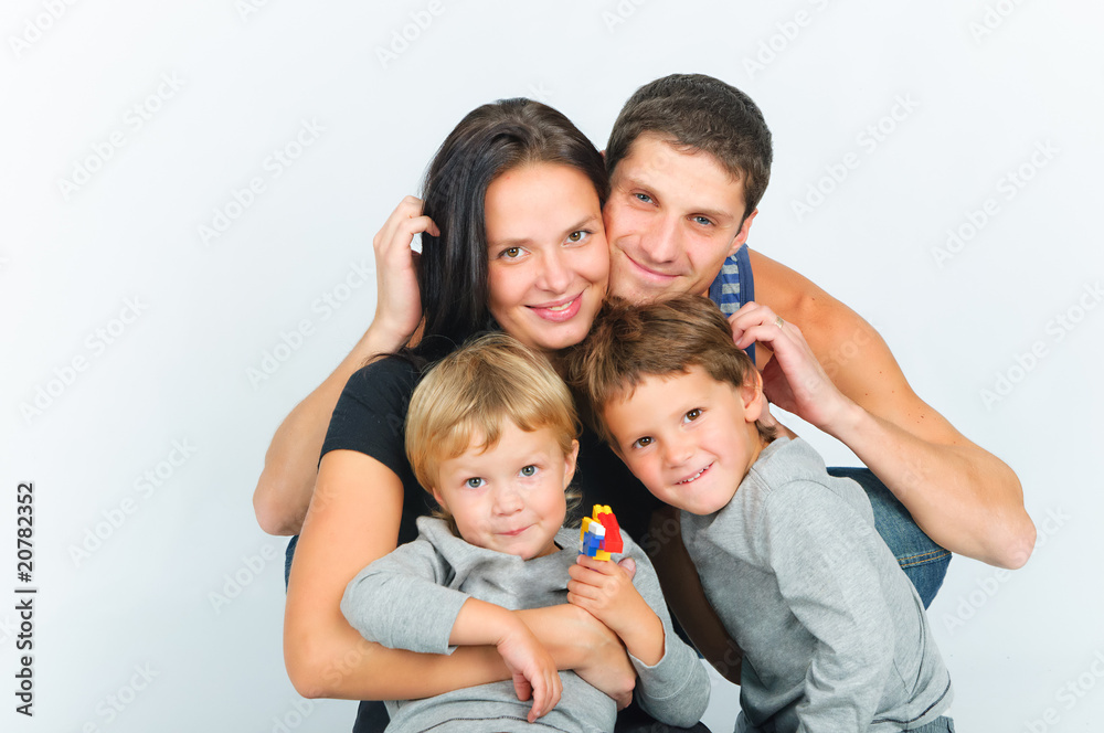 portrait of happy young family with two sons