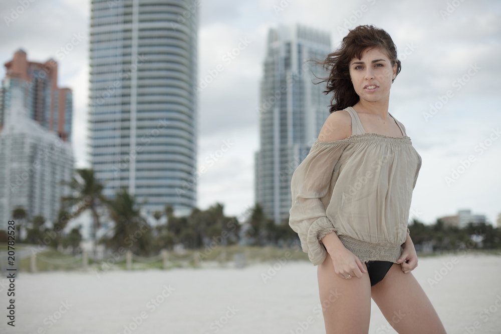 Beautiful woman posing on the beach Beautiful woman posing on the beach
