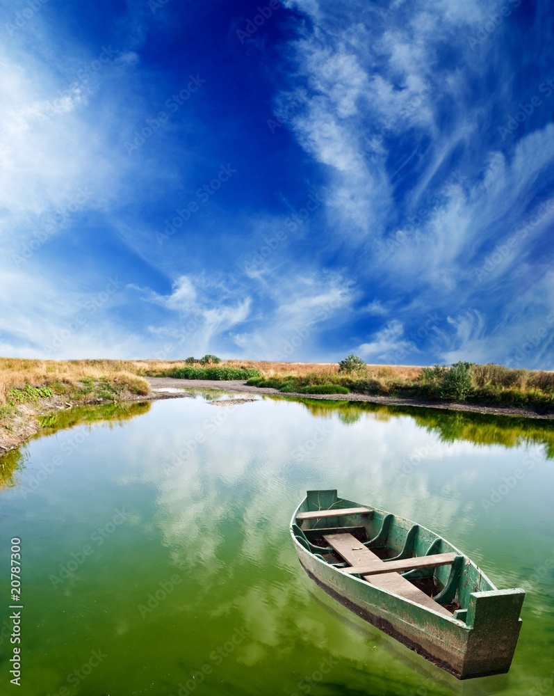 boat on a green lake