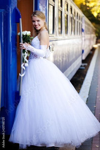 Beautiful young bride on a train