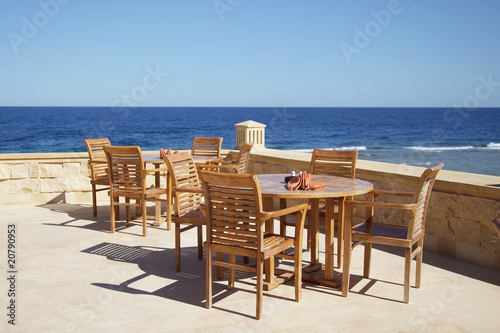 chair and table on sea background