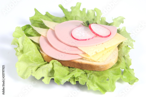Obraz na płótnie Ham sandwich with cheese, radish and greenery w salonie