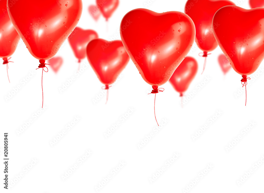 Set of red balloons in the shape of a heart flies skyward on a w Set of red balloons in the shape of a heart flies skyward on a w