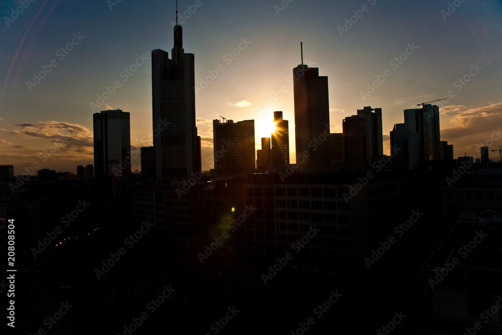 Naklejka premium sunset with skyscraper in Frankfurt downtown