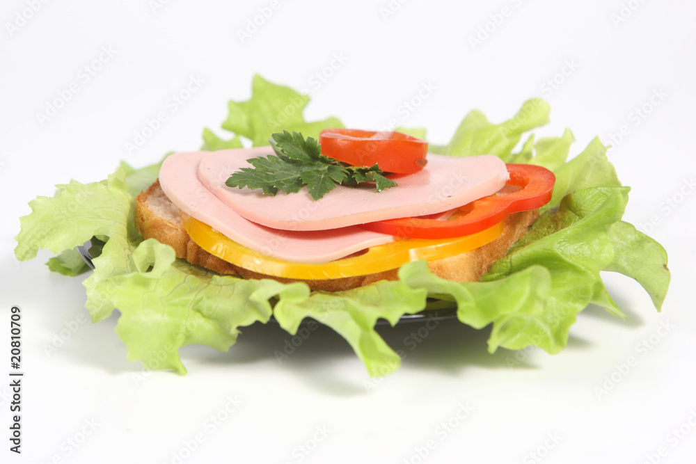 Ham sandwich with ripe potato, sweet red and yellow pepper and g