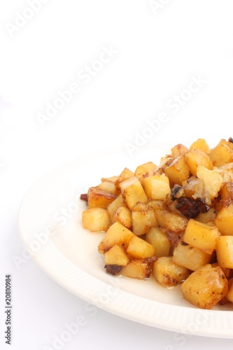 Fried potatoes with caramelized pork